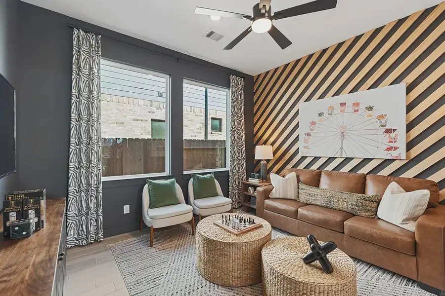 Furnished interior in a model home at Brookewater 60's in Rosenberg (Image 8).