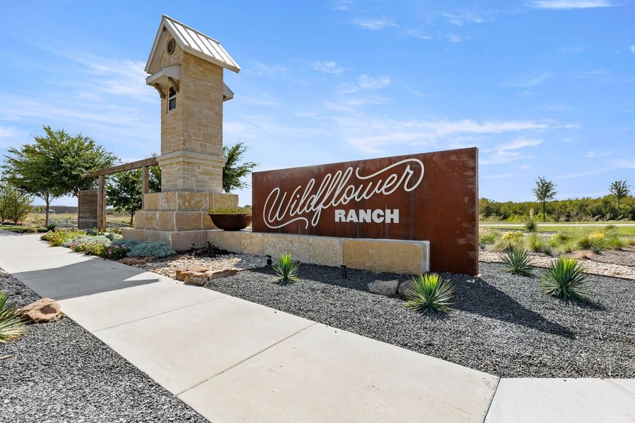 Entrance to the Wildflower Ranch community in Fort Worth, TX, featuring signage and landscaping (Image 12).
