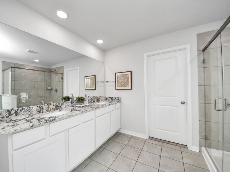 Furnished interior in a model home at Sunterra in Katy (Image 27).