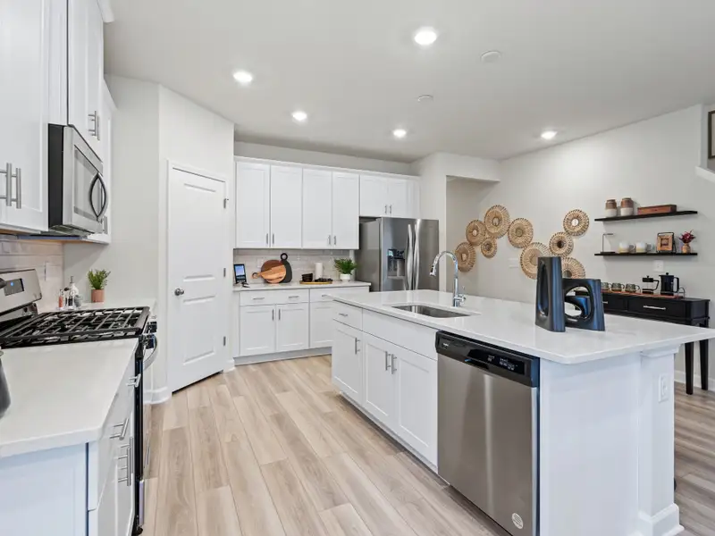 The kitchen is complete with stunning finishes, plenty of counterspace and a walk-in pantry.
