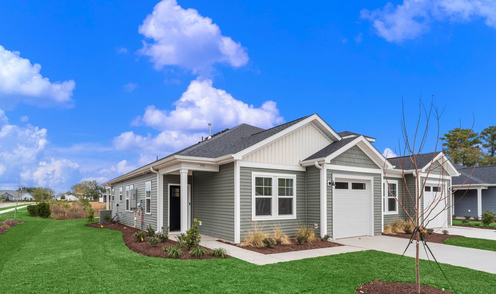 Front exterior of a home in the The Paired Villas at Bridgewater community, located in Little River, SC (Image 4).