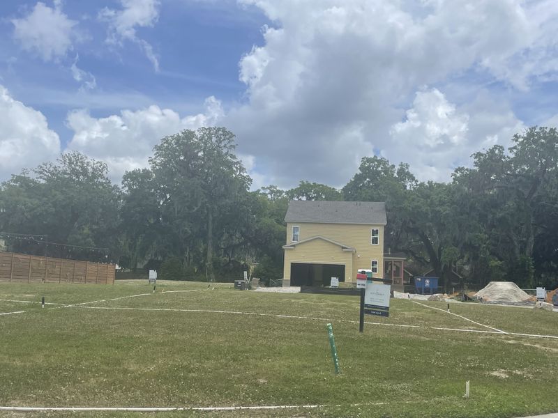 A charming yellow house amidst lush greenery in The Settlement at Ashley Hall by Homes by Dickerson (Charleston, SC). A charming yellow house amidst lush greenery in The Settlement at Ashley Hall by Homes by Dickerson (Charleston, SC).