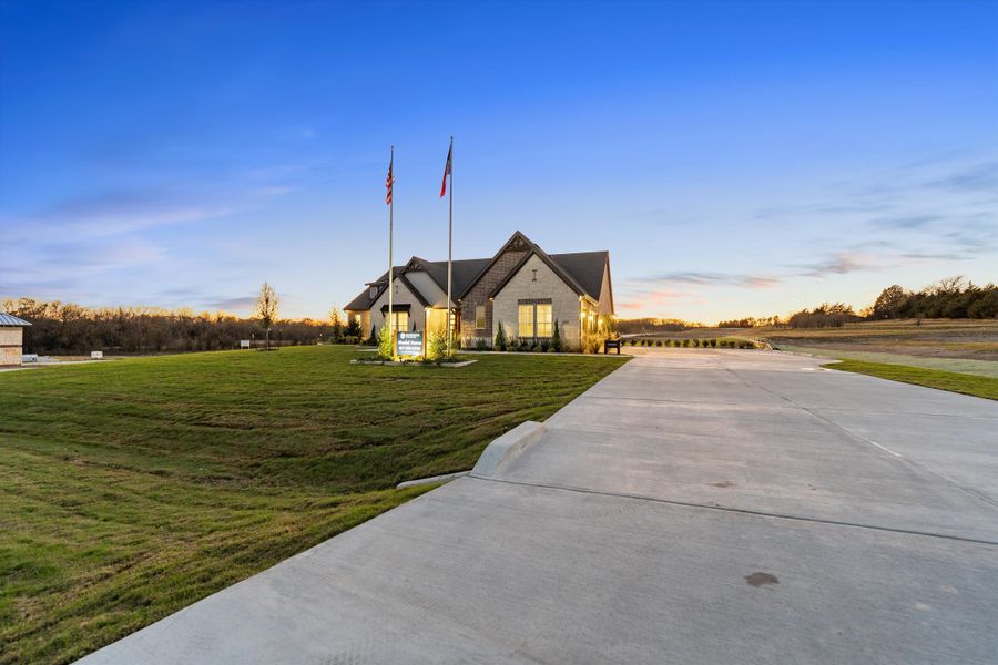 Front exterior of a home in the Grayson Ridge community, located in Van Alstyne, TX (Image 25).