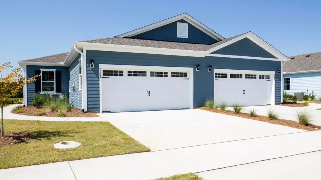 Front exterior of a home in the The Retreat at Indigo Preserve Townhomes community, located in Leland, NC (Image 5).