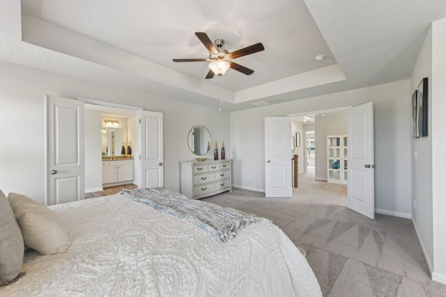 Furnished interior in a model home at The Hills at Cedar Creek in Winder (Image 57).
