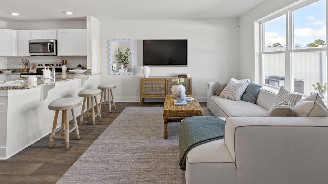 Furnished interior in a model home at Waterside Townhomes in Surf City (Image 15).
