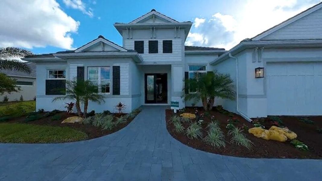 Front exterior of a home in the Artisan at Watercolor Place community, located in Bradenton, FL (Image 57).
