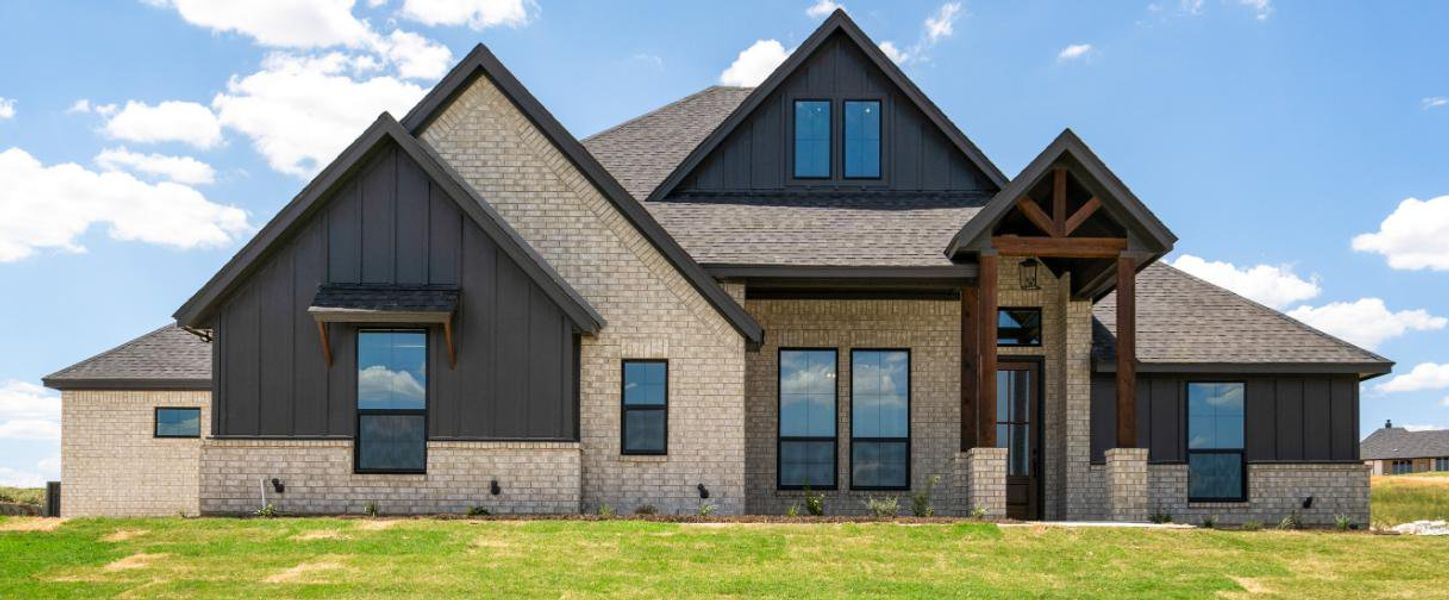 Front exterior of a home in the The Ranches at Valley View community, located in Springtown, TX (Image 8).