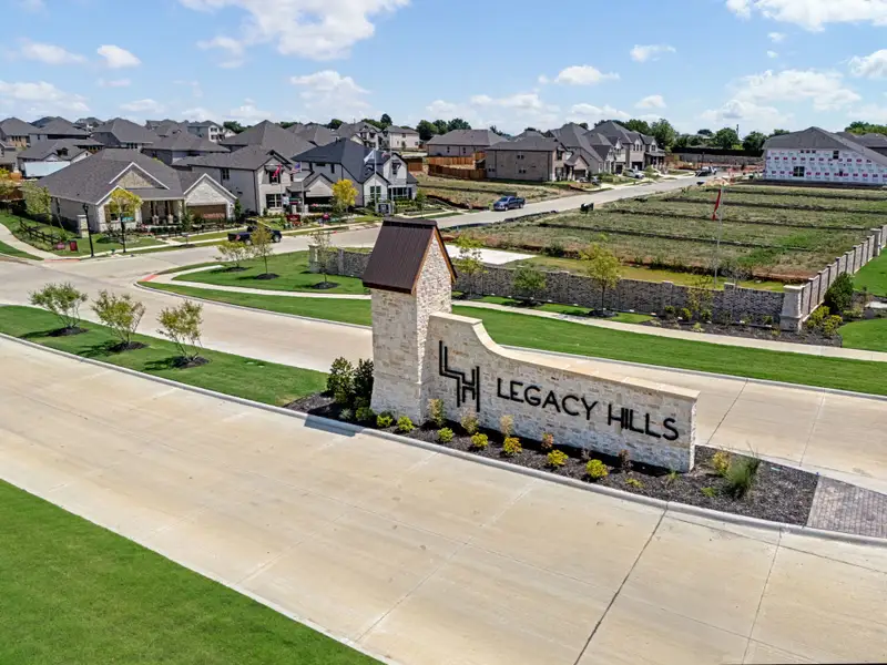 Entrance to the Legacy Hills community in Celina, TX, featuring signage and landscaping (Image 2).