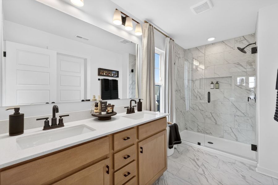 Furnished interior in a model home at North District at Flowers Plantation Townhomes in Clayton (Image 7).