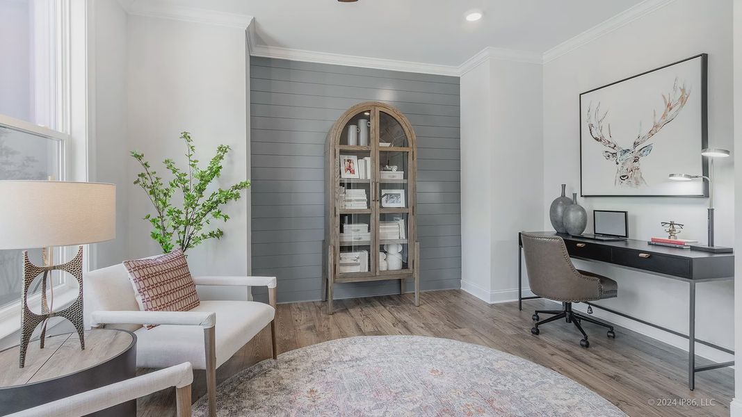 Furnished interior in a model home at The Courtyards at Redbud Lane in Holly Springs (Image 23).