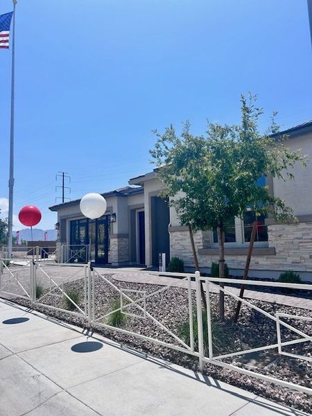 A sleek contemporary home with modern accents and a landscaped front yard in Estates at Laveen Vistas by Richmond American Homes (Laveen, AZ).
