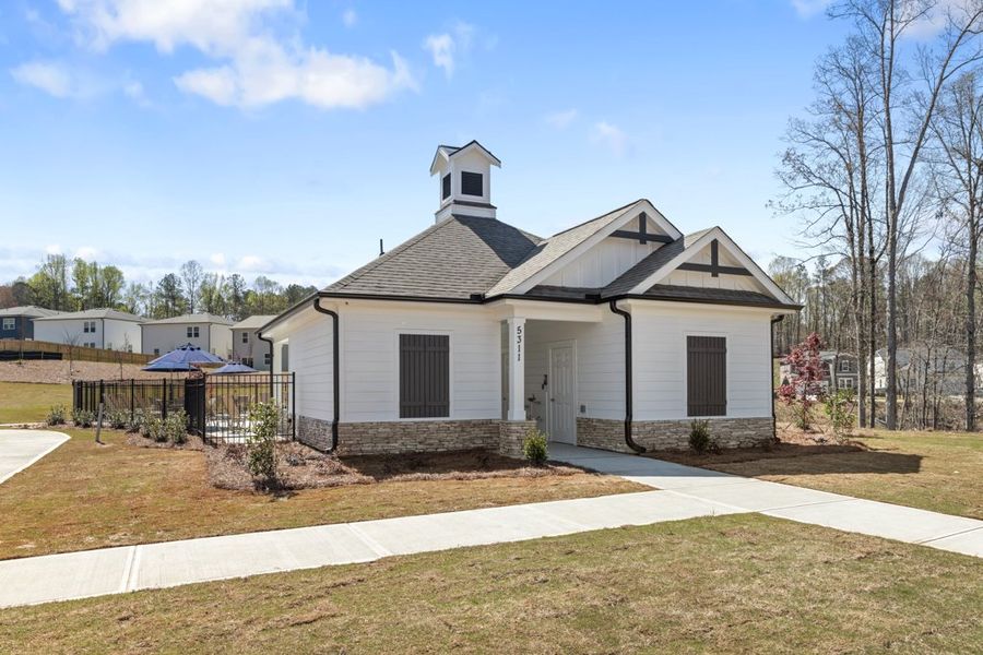 A house with a fence around it. A house with a fence around it.