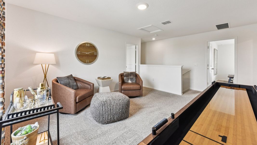 Furnished interior in a model home at Palomino in Manor (Image 36).