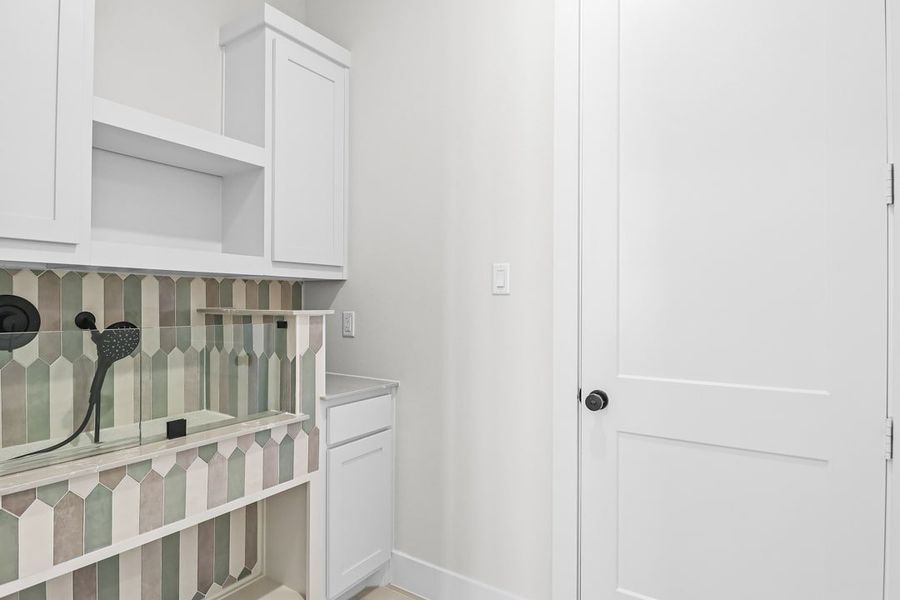 Furnished interior in a model home at Coppenger Place in Godley (Image 16).