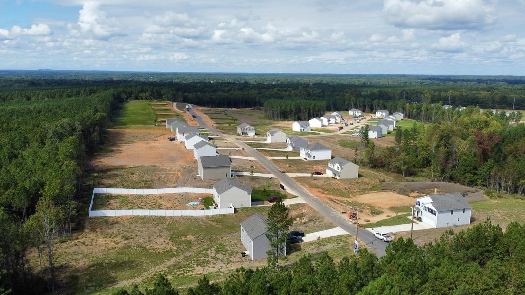 A group of buildings in a field. A group of buildings in a field.