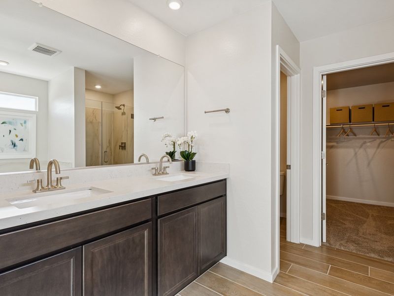 A bathroom with a tub sink and a shower.
