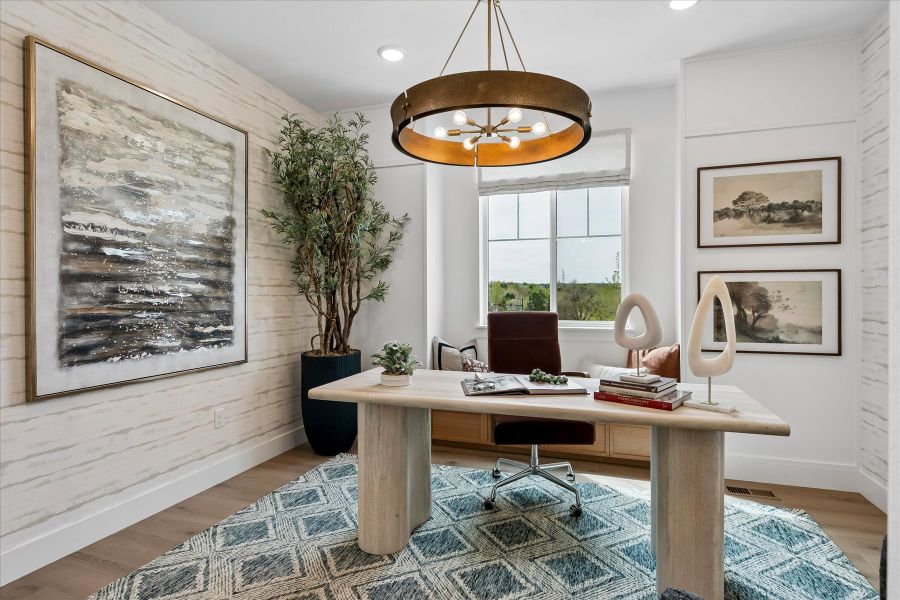 A room with a table and chairs.