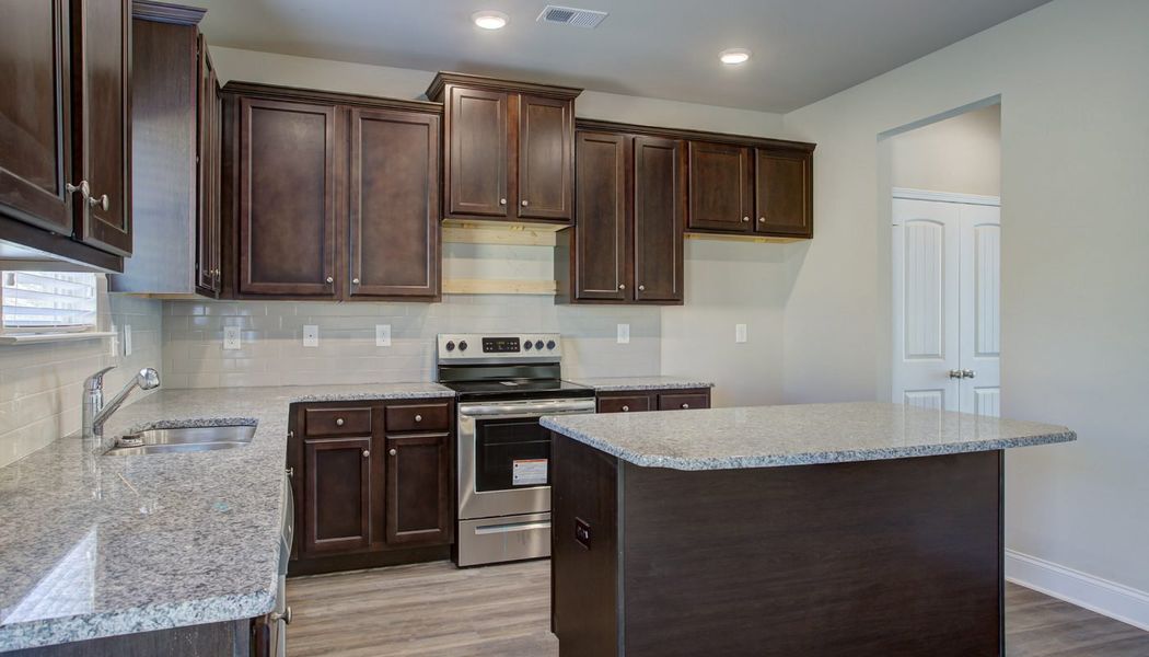Furnished interior in a model home at North Village in Rydal (Image 6).