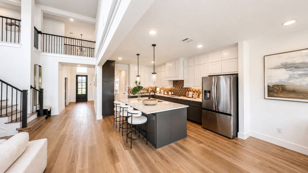 Furnished interior in a model home at Spiritas Ranch in Little Elm (Image 3).