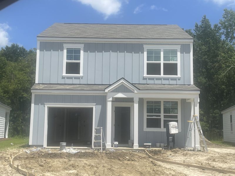 A charming two-story home under construction at The Oaks at Center Station by D.R. Horton in Hollywood, SC.