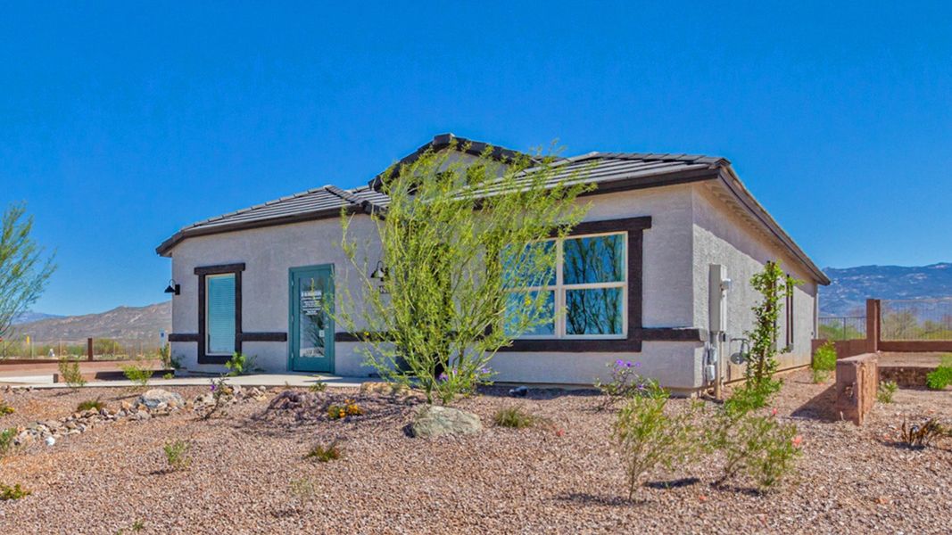 Front exterior of a home in the The Oasis at Rocking K community, located in Vail, AZ (Image 2).