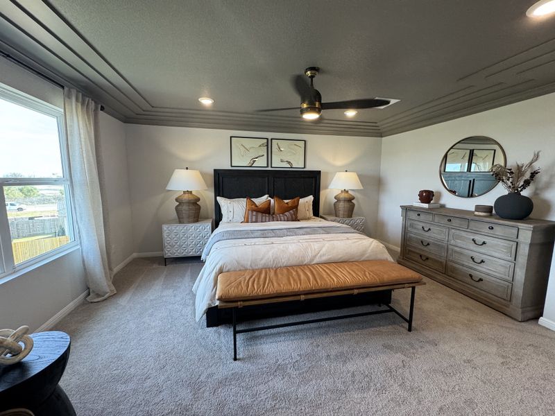 A cozy bedroom with elegant decor, featuring a plush bed, modern lamps, and a stylish dresser. A cozy bedroom with elegant decor, featuring a plush bed, modern lamps, and a stylish dresser.
