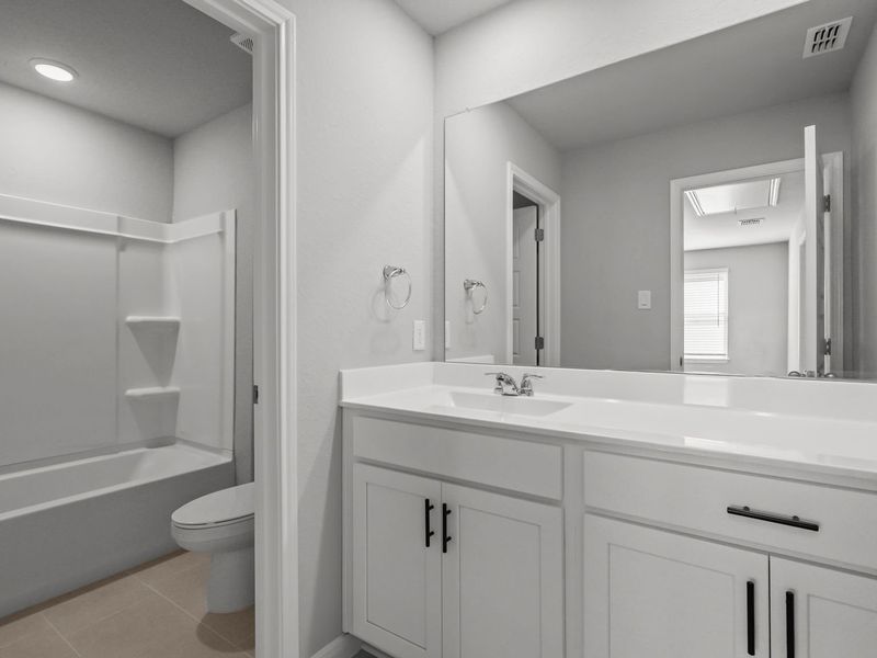 Furnished interior in a model home at Buffalo Way Villas in Houston (Image 16).