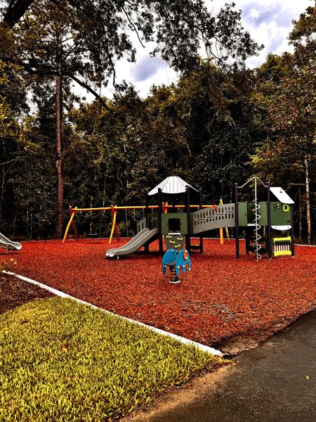 A vibrant playground with slides and swings in RiverTown - Springs by Mattamy Homes (St. Johns, FL). A vibrant playground with slides and swings in RiverTown - Springs by Mattamy Homes (St. Johns, FL).