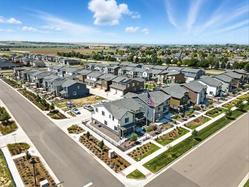 Aerial view of the Pintail Commons at Johnstown Village community in Johnstown, CO, showing layout and nearby surroundings (Image 12). Aerial view of the Pintail Commons at Johnstown Village community in Johnstown, CO, showing layout and nearby surroundings (Image 12).