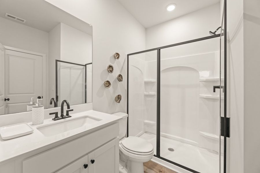 A bathroom with a glass shower.