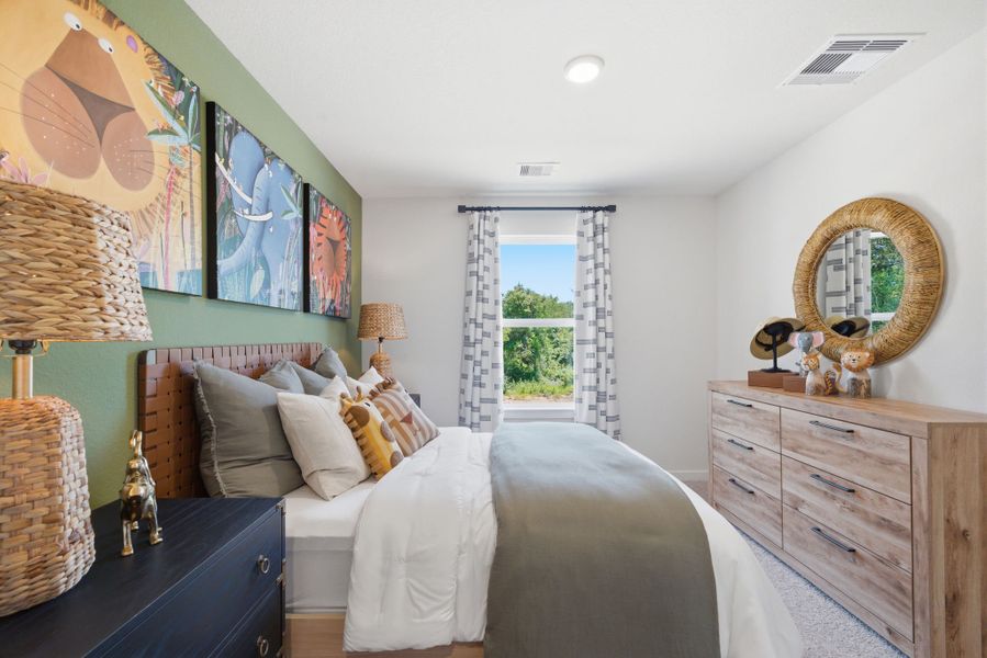 A bedroom with a bed and a dresser. A bedroom with a bed and a dresser.