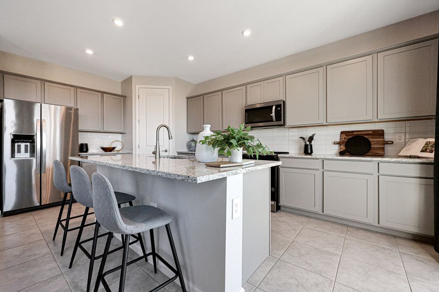 A kitchen with white cabinets. A kitchen with white cabinets.