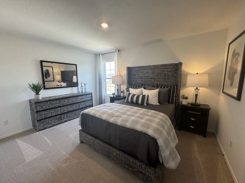 A cozy bedroom with textured wood furniture, neutral decor, and soft lighting for a serene atmosphere.
