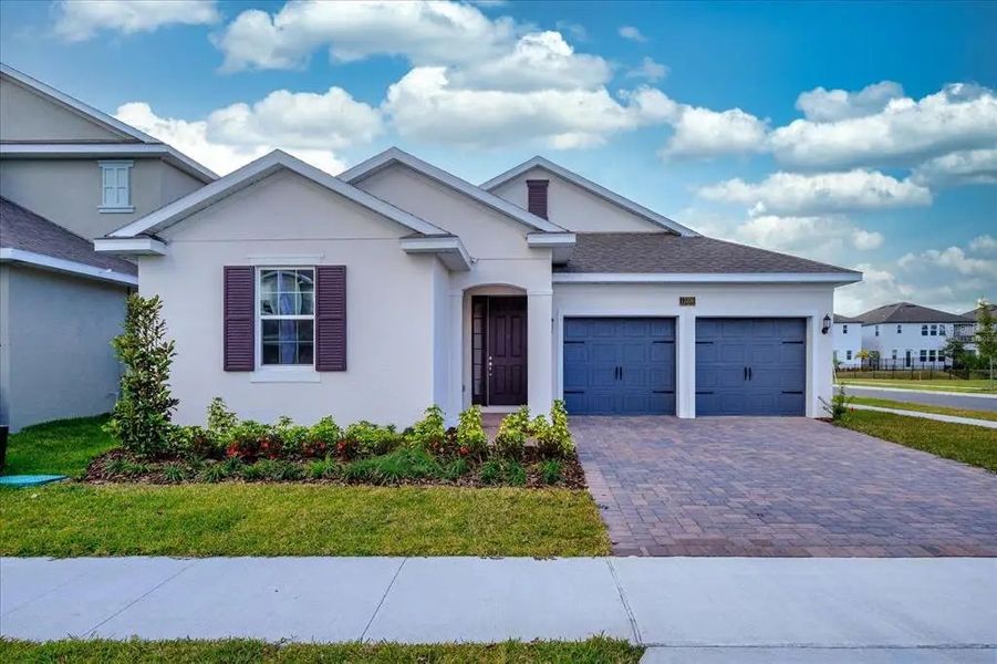 Front exterior of a home in the Serenade at Ovation 50' community, located in Oakland, FL (Image 9).