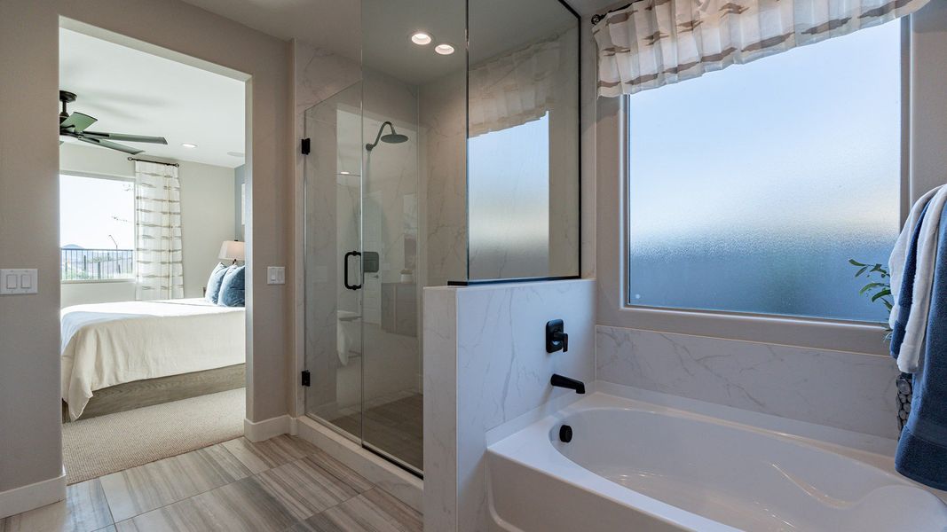 Indulge in luxury with elegant tile flooring and a sleek glass shower. The Villas at Mystic offers premium craftsmanship.