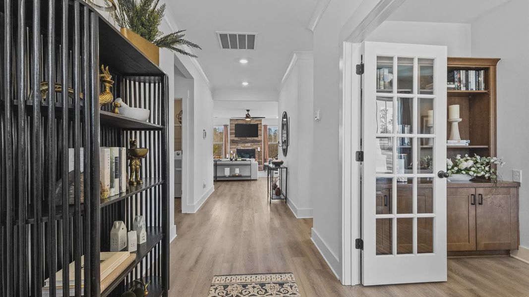 Vaulted ceiling entryway with hardwood flooring and white walls at Wells Crossing by DRB Homes in Seneca, SC