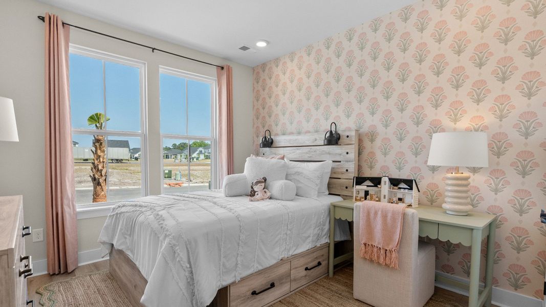 First-floor secondary bedroom in the Summit home plan with comfort and natural light.