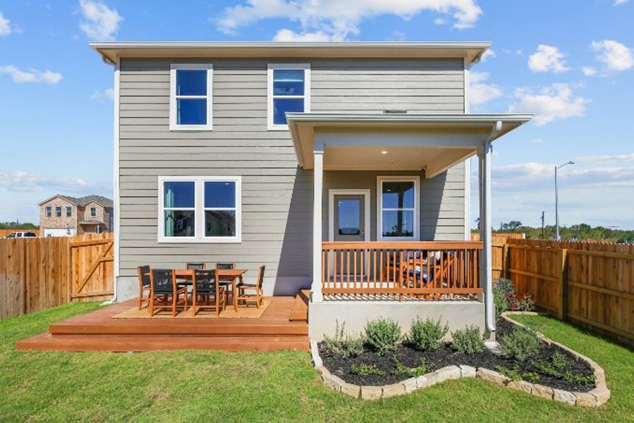 A small house with a deck.