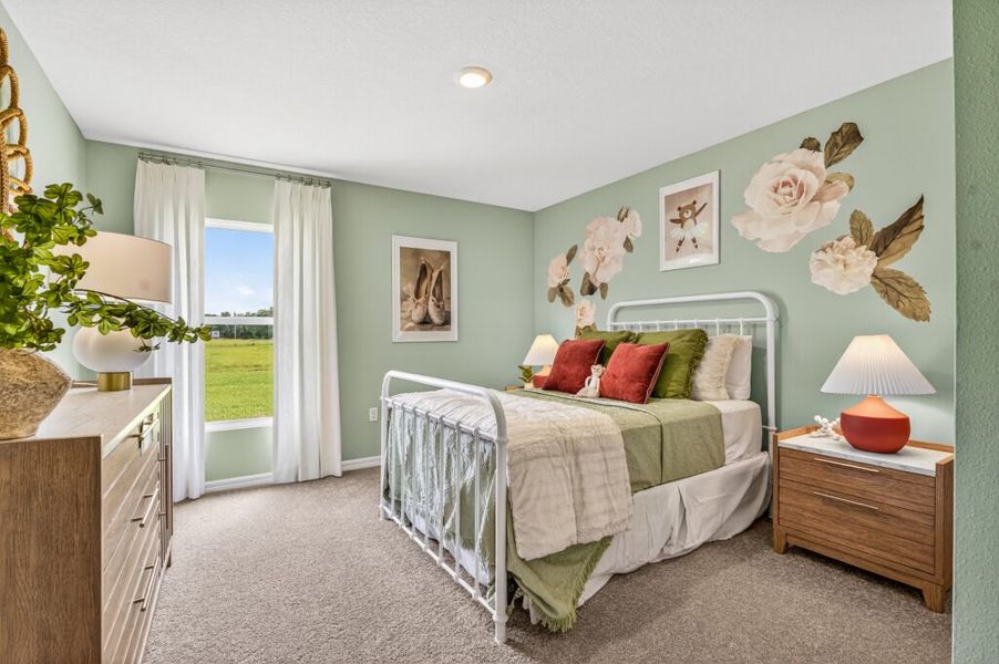 Furnished interior in a model home at Mallard Landing in Okeechobee (Image 15).