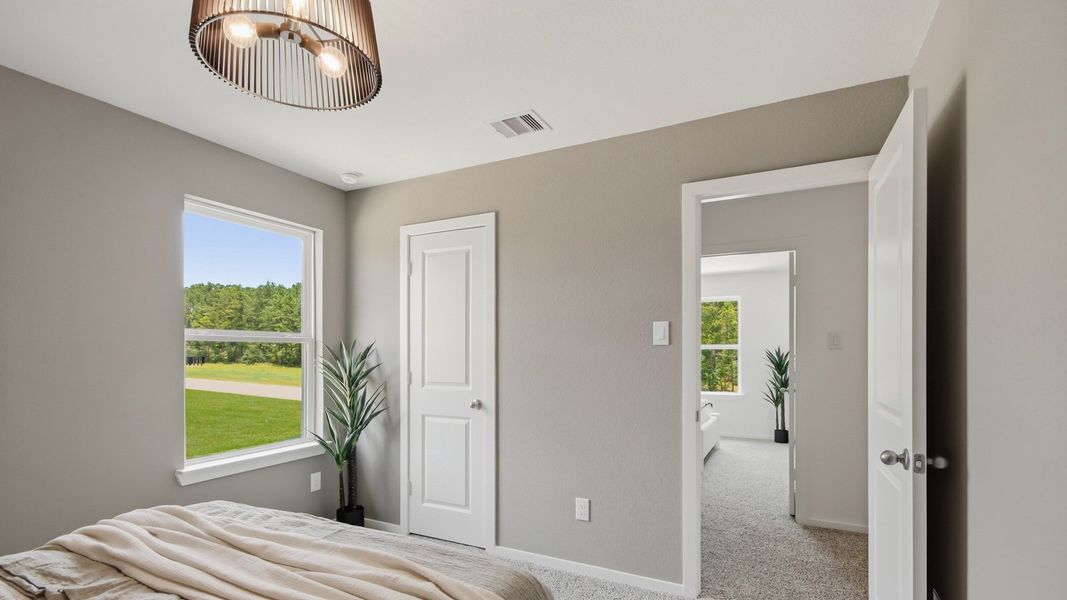Furnished interior in a model home at East Williams Cove in Conroe (Image 25). Furnished interior in a model home at East Williams Cove in Conroe (Image 25).