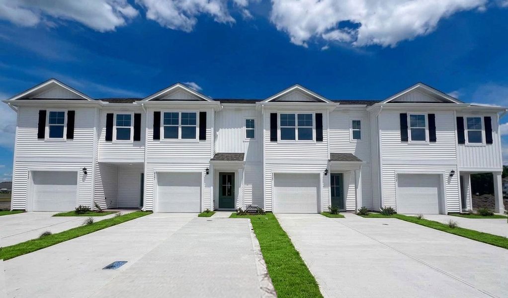 Front exterior of a home in the The Landing at Sidbury Station community, located in Castle Hayne, NC (Image 5). Front exterior of a home in the The Landing at Sidbury Station community, located in Castle Hayne, NC (Image 5).