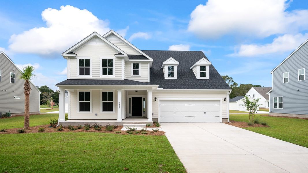 Front exterior of a home in the Ballam Oaks community, located in Mount Pleasant, SC (Image 10).
