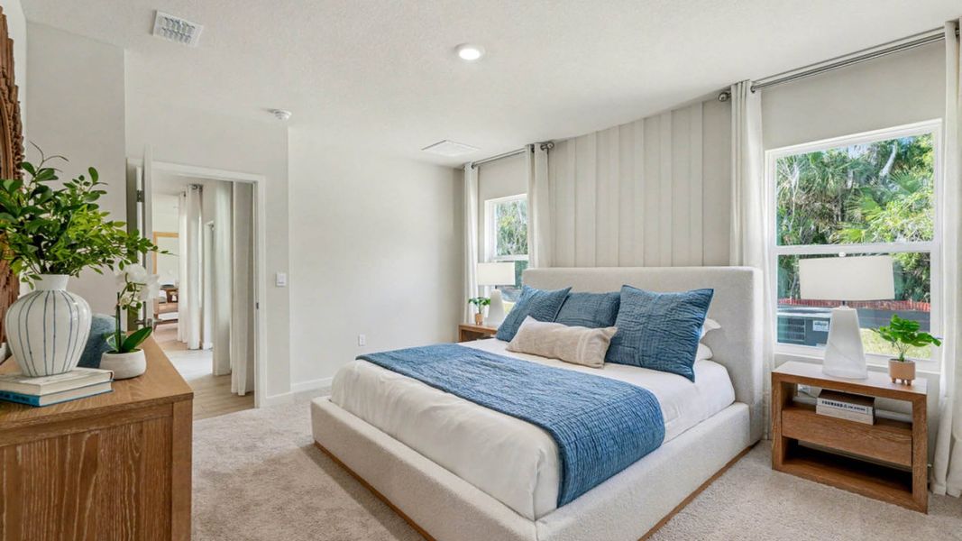 Furnished interior in a model home at Indian River Preserve in Mims (Image 17).