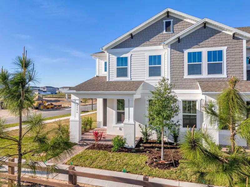 Front exterior of a home in the Harvest at Ovation - Townhomes community, located in Winter Garden, FL (Image 35).