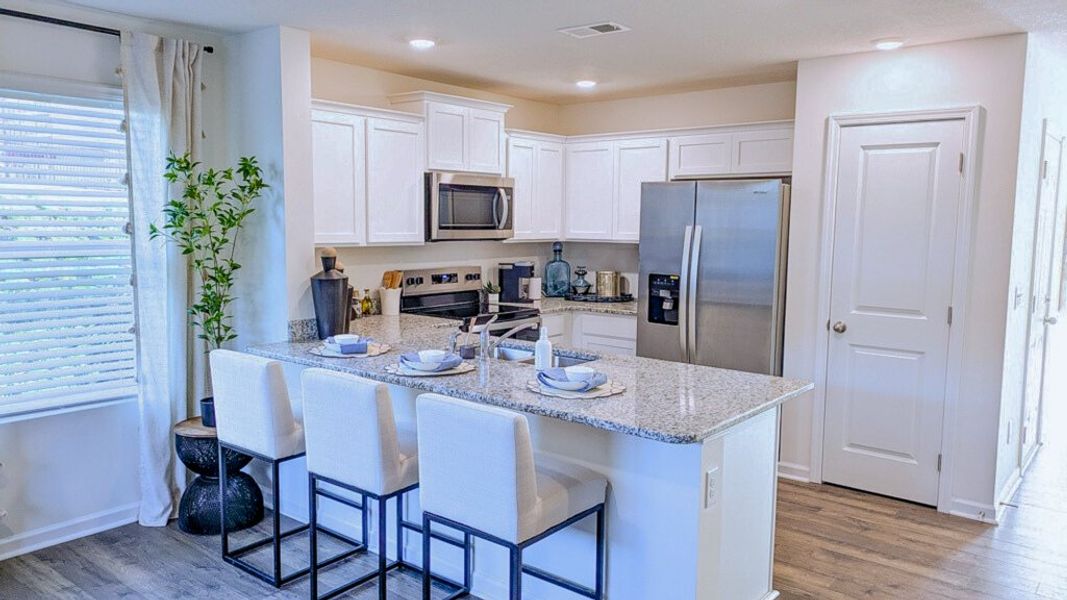 Furnished interior in a model home at Hudson Terrace Townhomes in Bristol (Image 3).