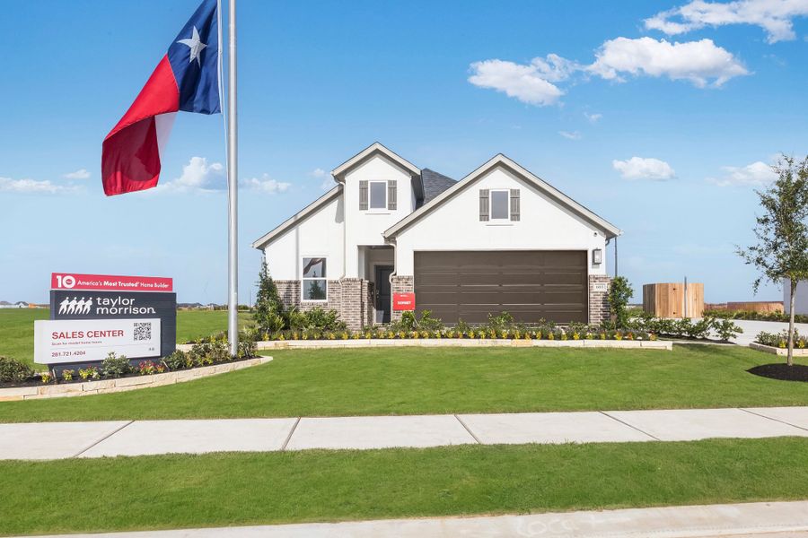 Front exterior of a home in the Raburn Reserve 50s community, located in Tomball, TX (Image 12).