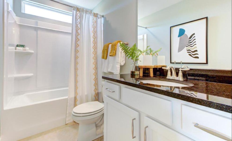 Furnished interior in a model home at CraigStone in Woodruff (Image 17).