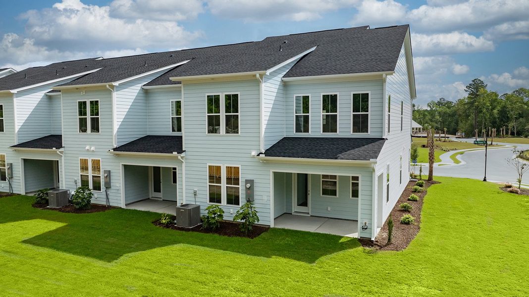 Front exterior of a home in the Grand Park community, located in Leland, NC (Image 26).