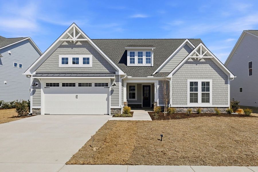 Front exterior of a home in the WyndWater community, located in Hampstead, NC (Image 37).